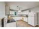 Bright kitchen with white cabinets, wood floors, and new countertops at 2640 S Silcox Rd, Paragon, IN 46166
