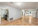 Open living space with a laundry area on one side and the kitchen on the other at 2640 S Silcox Rd, Paragon, IN 46166