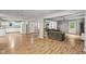 Open-concept living room with hardwood floors, comfortable seating, and ample natural light at 2640 S Silcox Rd, Paragon, IN 46166