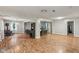 Spacious living room featuring beautiful wood floors, wood stove, and neutral paint at 2640 S Silcox Rd, Paragon, IN 46166