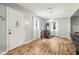 Cozy living room with hardwood floors, wood-burning stove, and natural light at 2640 S Silcox Rd, Paragon, IN 46166