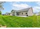 Backyard featuring a sunroom and patio at 2747 Stonebridge Dr, Lebanon, IN 46052