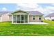 Backyard featuring a sunroom and patio at 2747 Stonebridge Dr, Lebanon, IN 46052