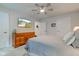Bright bedroom with ceiling fan, dresser, mounted television, and two closets at 2747 Stonebridge Dr, Lebanon, IN 46052