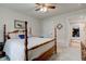 Bedroom featuring a four-poster bed with white linens and neutral walls at 2747 Stonebridge Dr, Lebanon, IN 46052