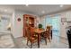 Dining room with wood table, china cabinet, sliding glass door to backyard, and neutral colors at 2747 Stonebridge Dr, Lebanon, IN 46052