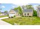 This well-maintained home is surrounded by a lush green lawn and mature trees at 2747 Stonebridge Dr, Lebanon, IN 46052