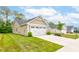 The property boasts a manicured lawn and an attached two-car garage at 2747 Stonebridge Dr, Lebanon, IN 46052