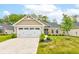 Charming single-story home features manicured lawn, stone accents, and a two-car garage at 2747 Stonebridge Dr, Lebanon, IN 46052