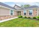 Inviting front yard with lush green grass and stone accents on the home's exterior at 2747 Stonebridge Dr, Lebanon, IN 46052