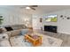 Cozy living room features a large sectional, hardwood floors, and a flat-screen TV at 2747 Stonebridge Dr, Lebanon, IN 46052