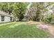 Spacious backyard featuring lush green grass and mature trees at 2945 N Denny St, Indianapolis, IN 46218