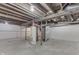 Unfinished basement showing support beams, concrete floor, and utility installations, potential for many possibilities at 2945 N Denny St, Indianapolis, IN 46218
