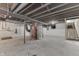 An unfinished basement with visible support beams and utilities, ready for customization at 2945 N Denny St, Indianapolis, IN 46218