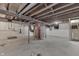 Unfinished basement featuring brick support column and water heater at 2945 N Denny St, Indianapolis, IN 46218
