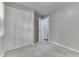 Bedroom showcasing a closet with bi-fold doors and a door leading to another room at 2945 N Denny St, Indianapolis, IN 46218