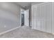 Carpeted bedroom with a closet and a doorway to another room, freshly painted at 2945 N Denny St, Indianapolis, IN 46218