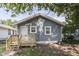 Home with blue siding, white trim, and a new wooden deck at 2945 N Denny St, Indianapolis, IN 46218