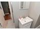 Bathroom featuring a single sink vanity with an above mirror in a neutrally decorated space at 305 N Warman Ave, Indianapolis, IN 46222