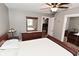 Comfortable bedroom with soft lighting and wooden furniture and neutral walls at 305 N Warman Ave, Indianapolis, IN 46222