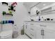 Bathroom features modern white cabinets, a large mirror, decorative shelves, and neutral decor at 3141 Citadel Ct, Indianapolis, IN 46268