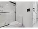 Modern bathroom featuring a glass enclosed shower, updated commode, and crisp white interior at 3141 Citadel Ct, Indianapolis, IN 46268