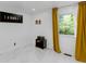Bright bedroom featuring stylish tile floors, modern art, and a sunlit window with decorative curtains at 3141 Citadel Ct, Indianapolis, IN 46268