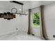 Serene bedroom with large windows, modern light fixture, and marble floors at 3141 Citadel Ct, Indianapolis, IN 46268