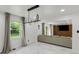 Bright living room boasts large windows, elegant drapes, recessed lighting, and opens to more living space at 3141 Citadel Ct, Indianapolis, IN 46268