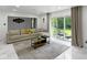 A bright living room with large sliding doors opening to the backyard and a comfortable sectional sofa at 3141 Citadel Ct, Indianapolis, IN 46268