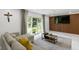 Living area with a sectional sofa, modern wood accent wall, and sliding glass doors for indoor-outdoor living at 3141 Citadel Ct, Indianapolis, IN 46268