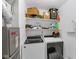 Spacious utility room with laundry machines and storage shelves at 3141 Citadel Ct, Indianapolis, IN 46268