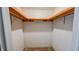Walk-in closet features painted wood trim and shelving for organized storage at 3215 E 10Th St, Anderson, IN 46012