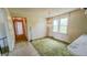 Dining room with textured green carpet and chandelier at 3215 E 10Th St, Anderson, IN 46012