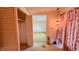 Entryway of home features floral curtains, hanging pendant, and access to the closet at 3215 E 10Th St, Anderson, IN 46012