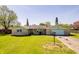 Charming single-story brick home with a well-maintained lawn and attached garage at 3215 E 10Th St, Anderson, IN 46012