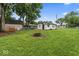 Expansive backyard features an outdoor fire pit, lush lawn, and room for outdoor activities at 3453 W 12Th St, Indianapolis, IN 46222