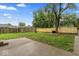 Spacious backyard featuring a concrete patio, well-maintained lawn, and a newly-built wooden fence for added privacy at 3453 W 12Th St, Indianapolis, IN 46222