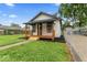 Quaint house with a covered porch, perfect for enjoying the outdoors at 3453 W 12Th St, Indianapolis, IN 46222
