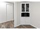 Built-in hutch, with white trim and walls, complimented by wood-look flooring in this living space at 3453 W 12Th St, Indianapolis, IN 46222