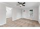 Cozy living room featuring neutral walls, plush carpeting, and a ceiling fan at 3453 W 12Th St, Indianapolis, IN 46222