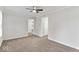 Spacious living room featuring plush carpet and a view into an adjacent room at 3453 W 12Th St, Indianapolis, IN 46222