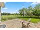 Backyard with a patio, view of the green lawn, pond, and mature trees at 3779 Crest Point Dr, Westfield, IN 46062