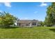 Backyard with green lawn and the home's exterior; perfect for outdoor activities and relaxation at 3779 Crest Point Dr, Westfield, IN 46062