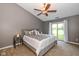 Comfortable bedroom featuring a ceiling fan and access to the backyard at 3779 Crest Point Dr, Westfield, IN 46062