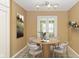 Charming breakfast nook featuring a round table and access to the backyard at 3779 Crest Point Dr, Westfield, IN 46062
