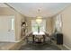 Bright dining room featuring a modern chandelier and neutral decor at 3779 Crest Point Dr, Westfield, IN 46062