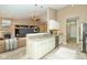 Open kitchen offers a breakfast bar and stainless-steel appliances, flowing into a cozy living space at 3779 Crest Point Dr, Westfield, IN 46062
