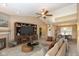 Bright living room featuring a fireplace, entertainment center, and view into the dining area at 3779 Crest Point Dr, Westfield, IN 46062