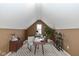 Attic office with neutral colors, a desk, comfortable seating, and built-in shelving at 3779 Crest Point Dr, Westfield, IN 46062